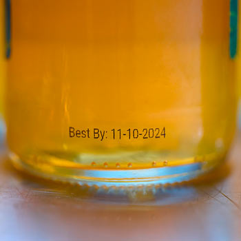 Date printed with AP-CODE on soda bottle