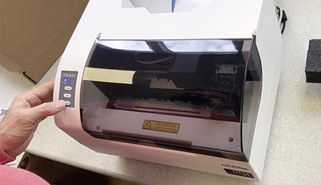 Press the Unload Button from LX610e Label Printer