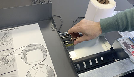 Remove label roll and move guide to left of the LX3000e Printer